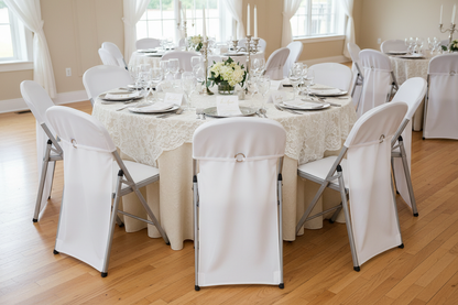 5ft round table set with 8 common folding white chairs made of metal and plastic with chair covers on them